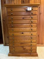 Front view showing full 12-drawer arrangement and pulls