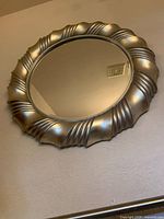Full view of circular mirror mounted on wall
