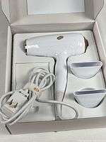 Hair dryer with cord and two concentrators in box