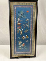 Full view of framed embroidery