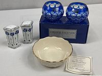 Group shot of Lenox bowl, two Crystal Legends blue votives in box, and pair of floral salt & pepper shakers
