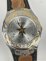 Front view of Montana Time watch showing dial, case and western motifs