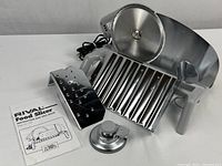 Overall slicer with blade, platform, pusher, dial and manual