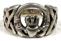 Front view showing Claddagh motif and .925 marking inside band