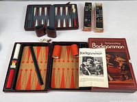 All items overview: two backgammon sets open with pieces, two domino sets in trays