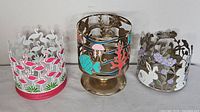 Group shot of three decorative Bath & Body Works candle holders
