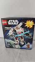 Front of sealed Lego Star Wars set 75390 showing X-Wing model and piece count