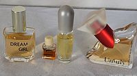 Front view of all four miniature perfume bottles