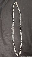 Full view of sterling Figaro chain necklace