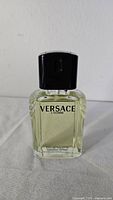 Front of Versace L’Homme bottle showing label and cap
