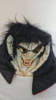 Full view of Dracula mask showing hair, collar, facial features