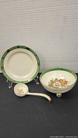 Set showing plate, footed bowl and spoon with matching design