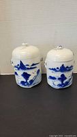 Front view of both ginger jars with lids on