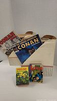 Front view showing both Conan comics, Spider-Man and Batman books