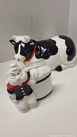 Cow cookie jar and Popeye napkin holder together