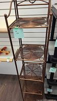 Front view showing entire copper folding shelf with four mesh shelves