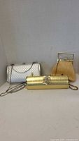 All three evening purses displayed together