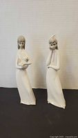 Both Emigue porcelain lady figurines front view