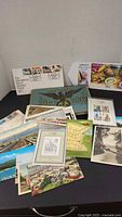 Overview of postcards, stamp album, first day covers