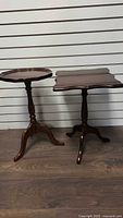 Round and square wood pedestal tables side by side