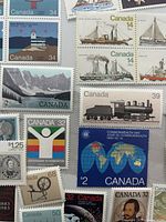 Assorted Canadian mint stamps showing various designs and denominations
