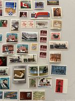 Wide view of multiple mint Canada stamps showing denominations and designs