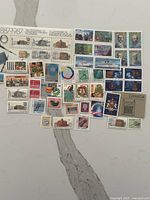 Full layout of all mint stamps on surface