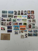 Overall view of entire lot showing all mint Canadian stamps laid out
