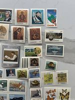 Left-side close-up of architecture, art, religious icon stamps