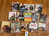 All 14 cookbooks laid out showing covers
