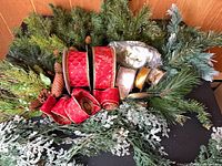 Ribbon rolls and mixed greenery grouped together