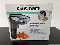Front of boxed Cuisinart vacuum sealer system showing product image and bag count