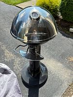 Full view of assembled Masterbuilt pedestal grill outdoors