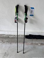 Full view of both Terra Hiker trekking poles with rubber tips and carry bag