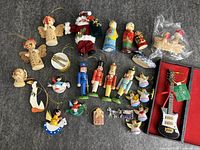 All ornaments laid out on grey surface including guitar case