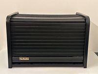 Closed black roll-top box front view showing Beatles plaque