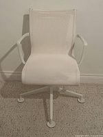 Front view of white mesh swivel office chair