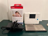 Printer, paper/ink pack, power adapter, paper cassette