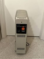 Front view showing control panel and vertical fins of heater