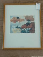 Full view of framed floral print showing frame, mat, and image