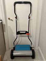 Full view of Gardena 380 C mower standing upright