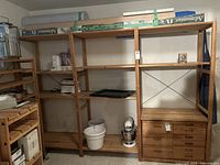 Full front view of triple-bay shelving showing shelves and drawer cabinet