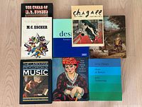 Eight books laid out, covers visible