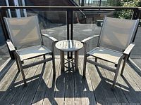 Full set with two chairs and table on deck