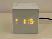 Front view with LED display lit showing time