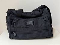 Front view showing exterior zip pocket, EP patch and overall shape