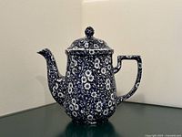 Front view of Burleigh blue floral ironstone coffee pot with lid