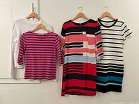 Group shot of all four garments on hangers