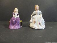 Both Royal Doulton figurines side by side
