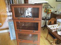 Full view of 4-door glass barrister bookcase in room setting